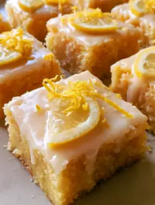 Close-up of Lemon Blondies showing the dense, moist crumb and thin lemon slices.