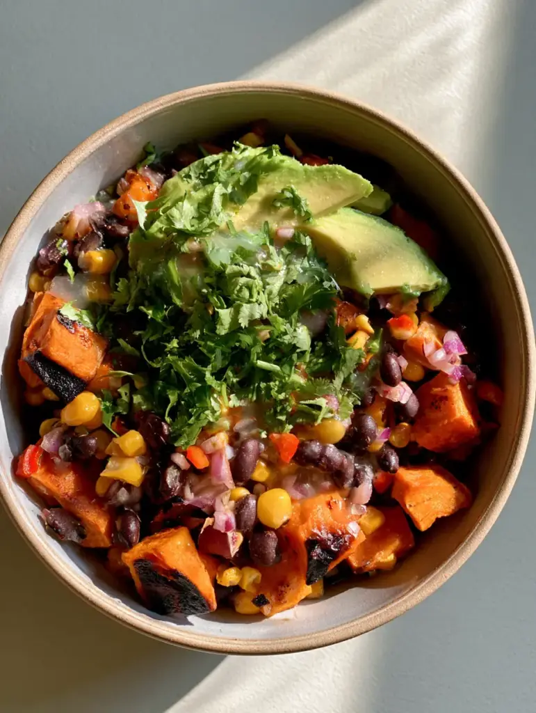 Roasted Sweet Potato Black Bean Salad: The Ultimate Nutrient-Packed Bowl 1 Close-up of matte black beans and golden corn kernels in a Roasted Sweet Potato Black Bean Salad.
